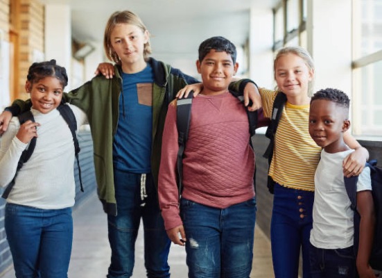 School children posing in a hallway.