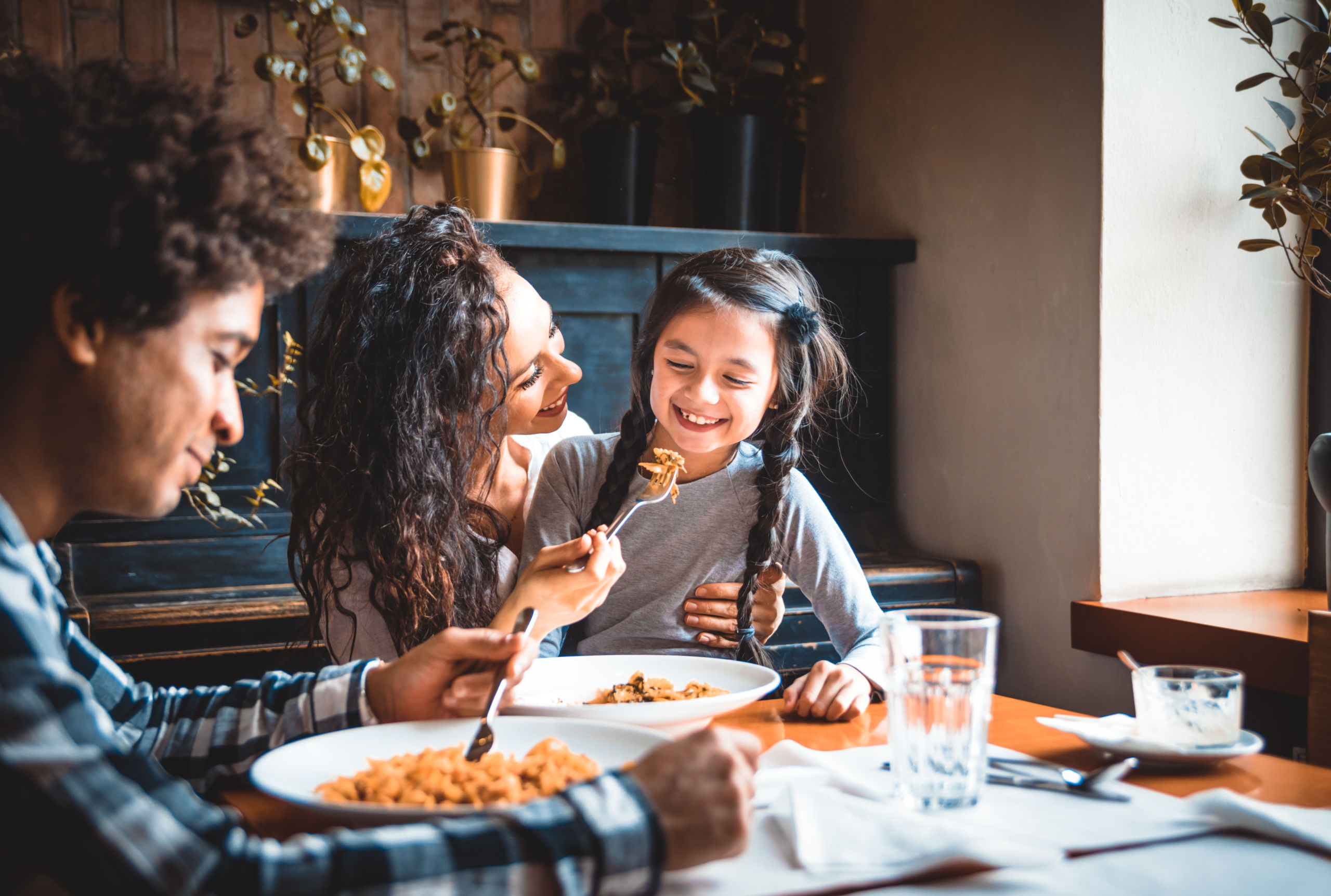 Hispanic family having dinner at home.